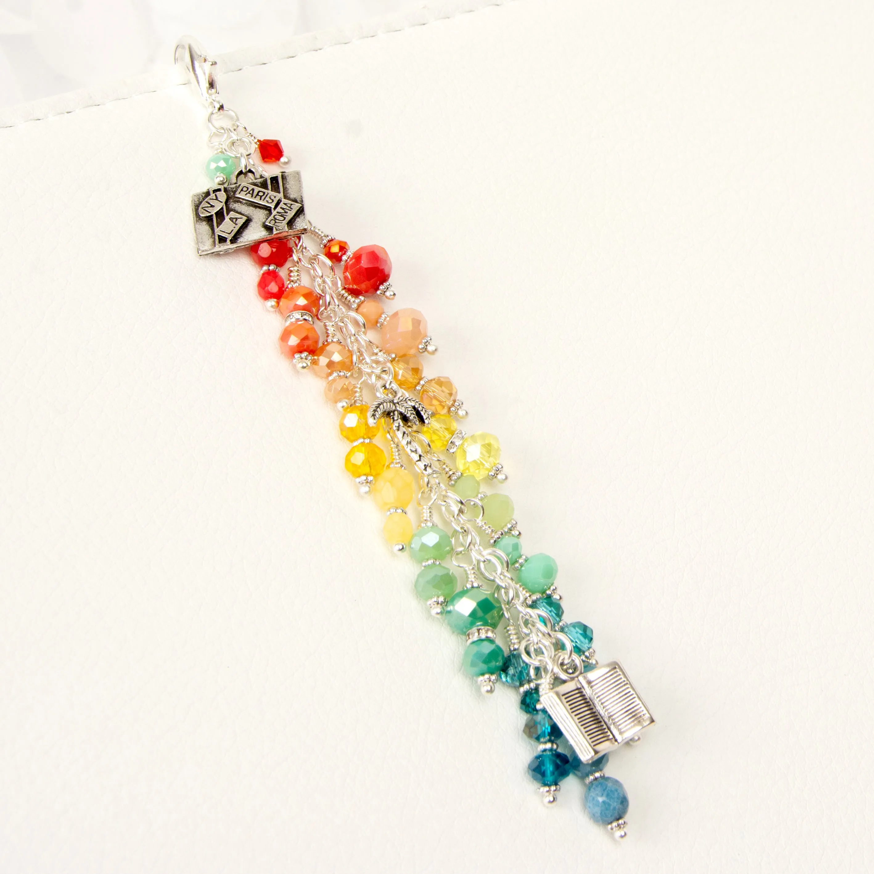 My Escape Planner Charm with a Rainbow Crystal Dangle and Book, Suitcase and Palm Tree Charms